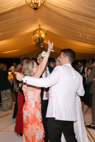 Packed dance floor celebration at Chateau des Charmes wedding reception