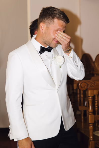 Emotional groom getting ready at Chateau des Charmes wedding
