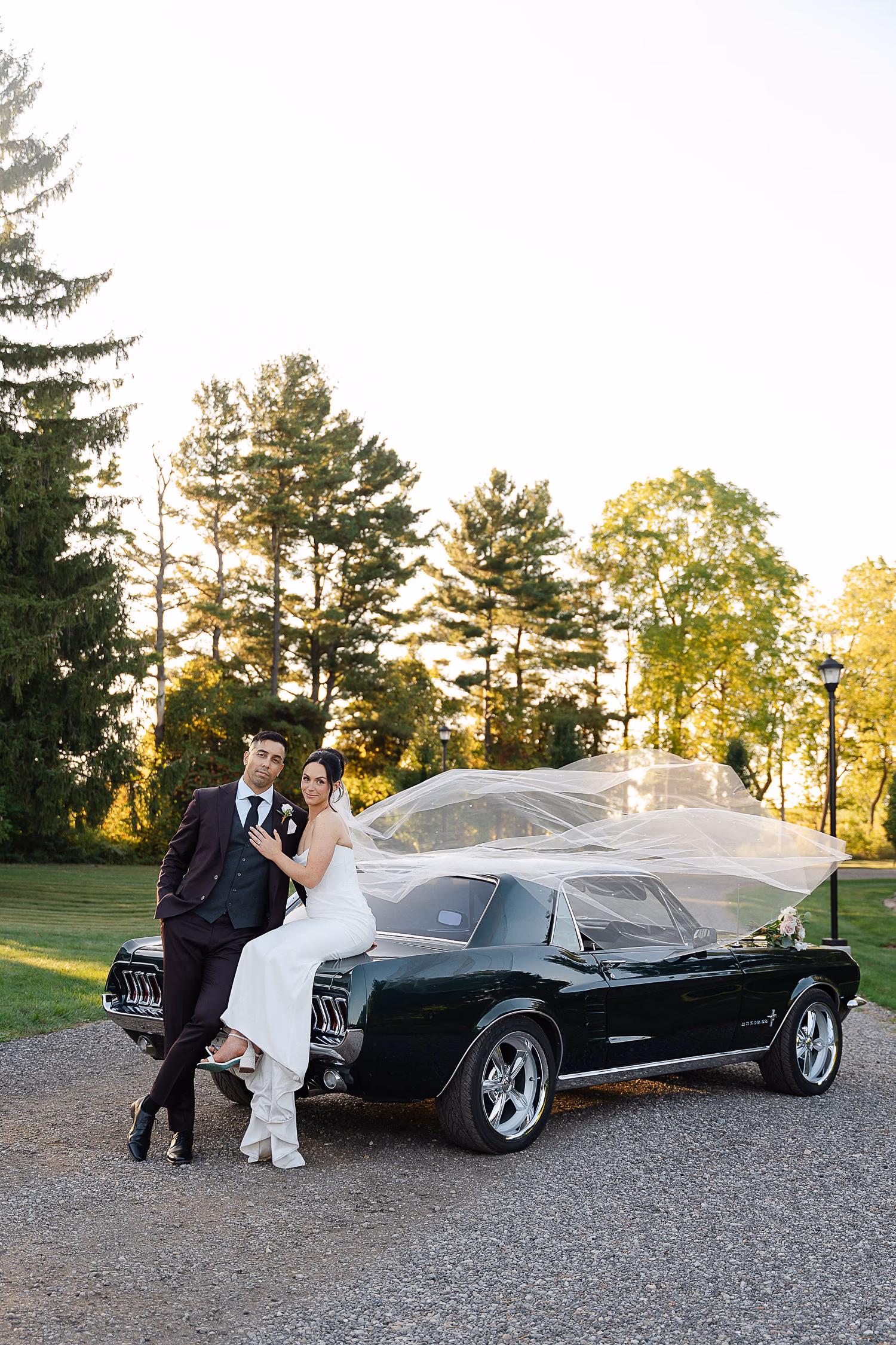 Elegant couple portrait with a retro car
