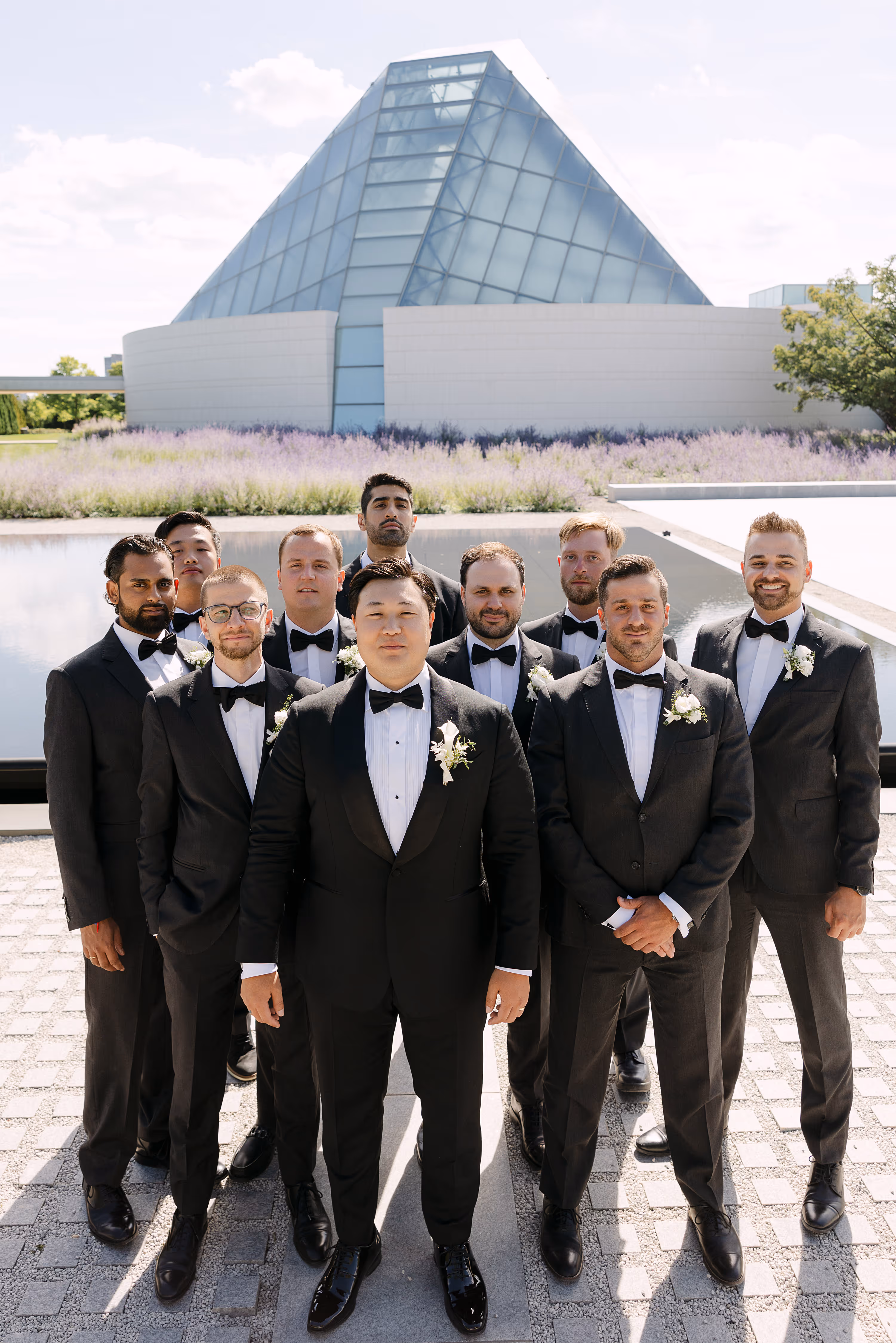 Groom posing with groomsmen at Aga Khan Museum