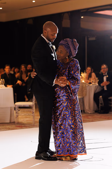 groom and mother dancing at Hotel X