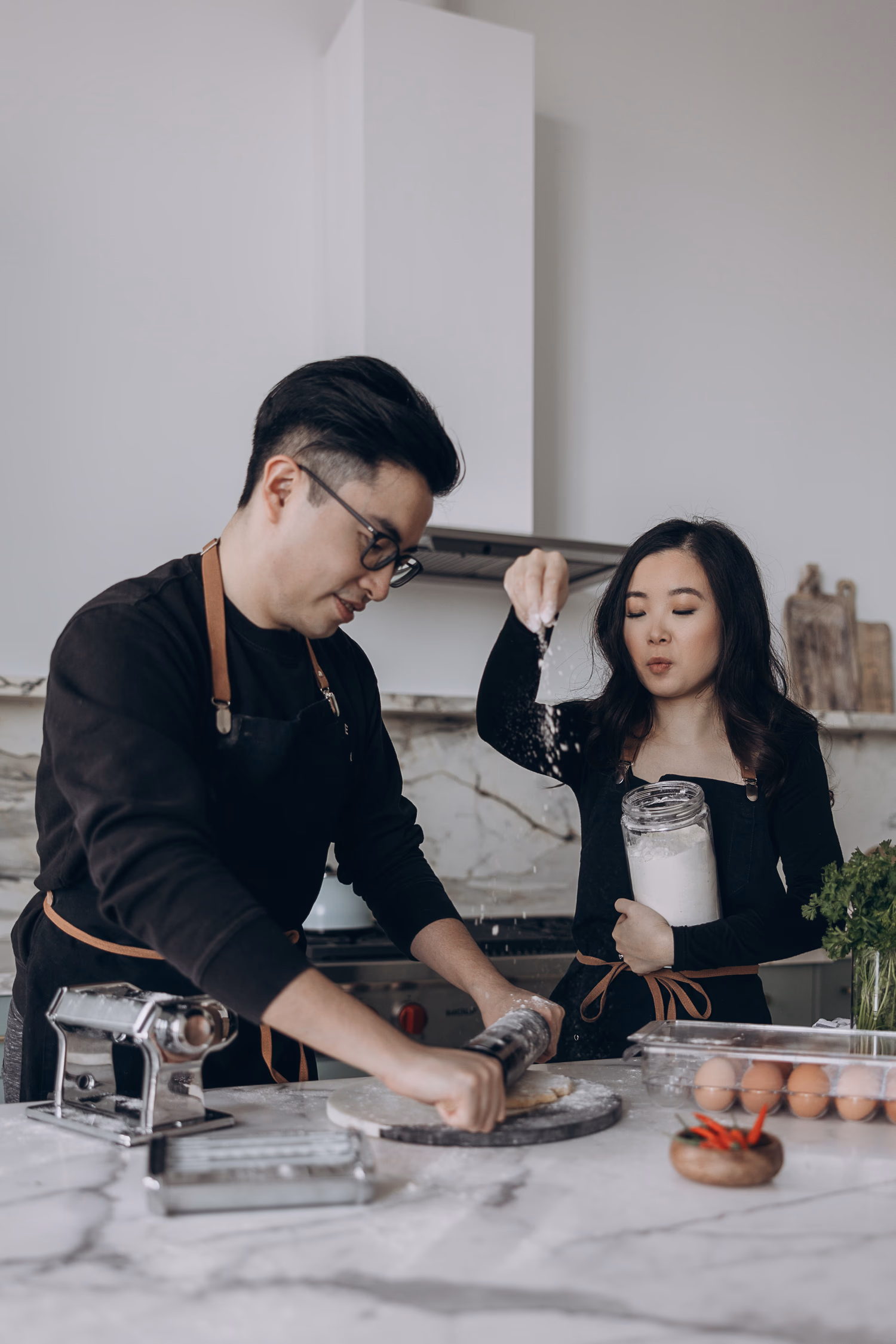 making pasta engagement photo