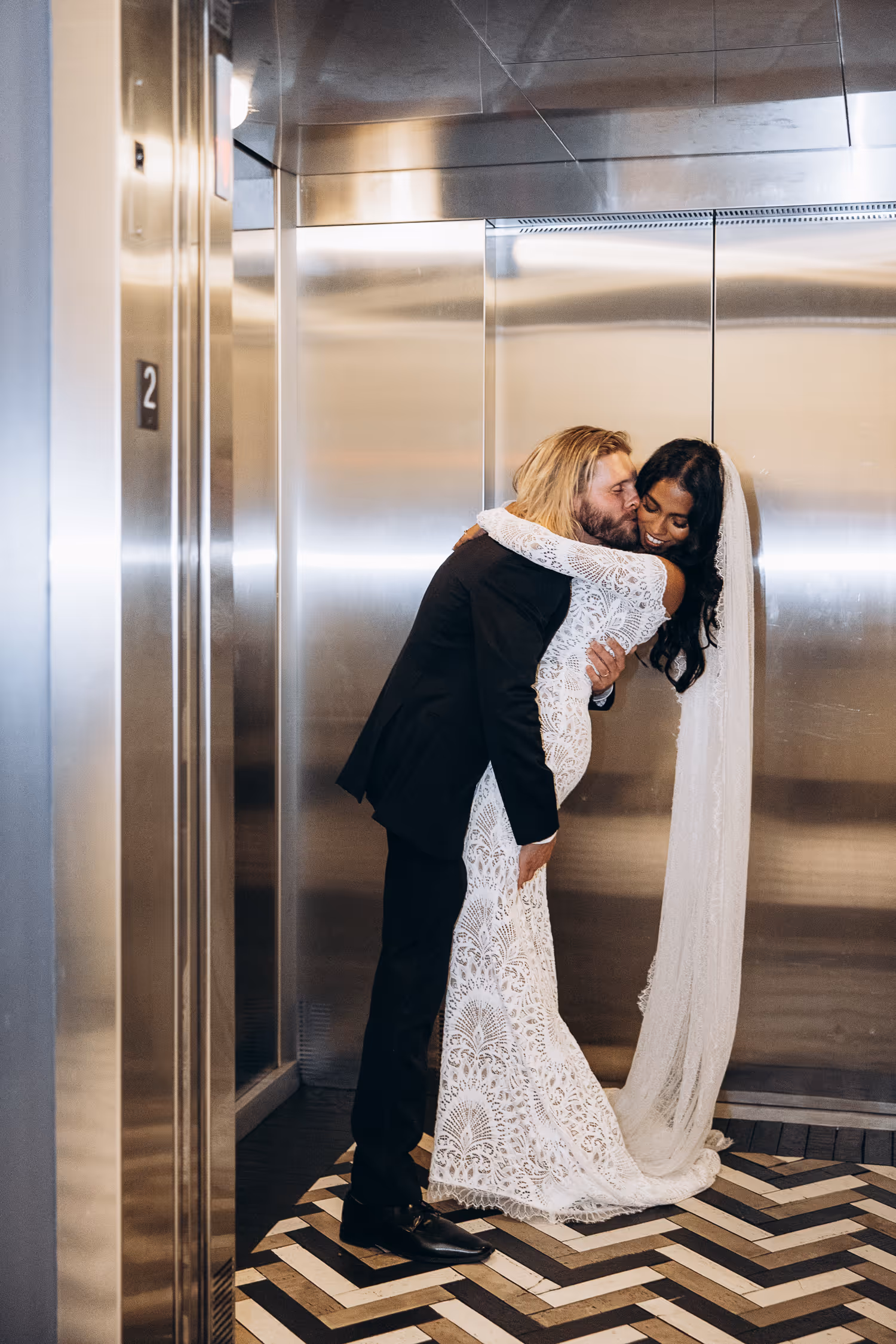 kissing at the elevator at One King West Hotel
