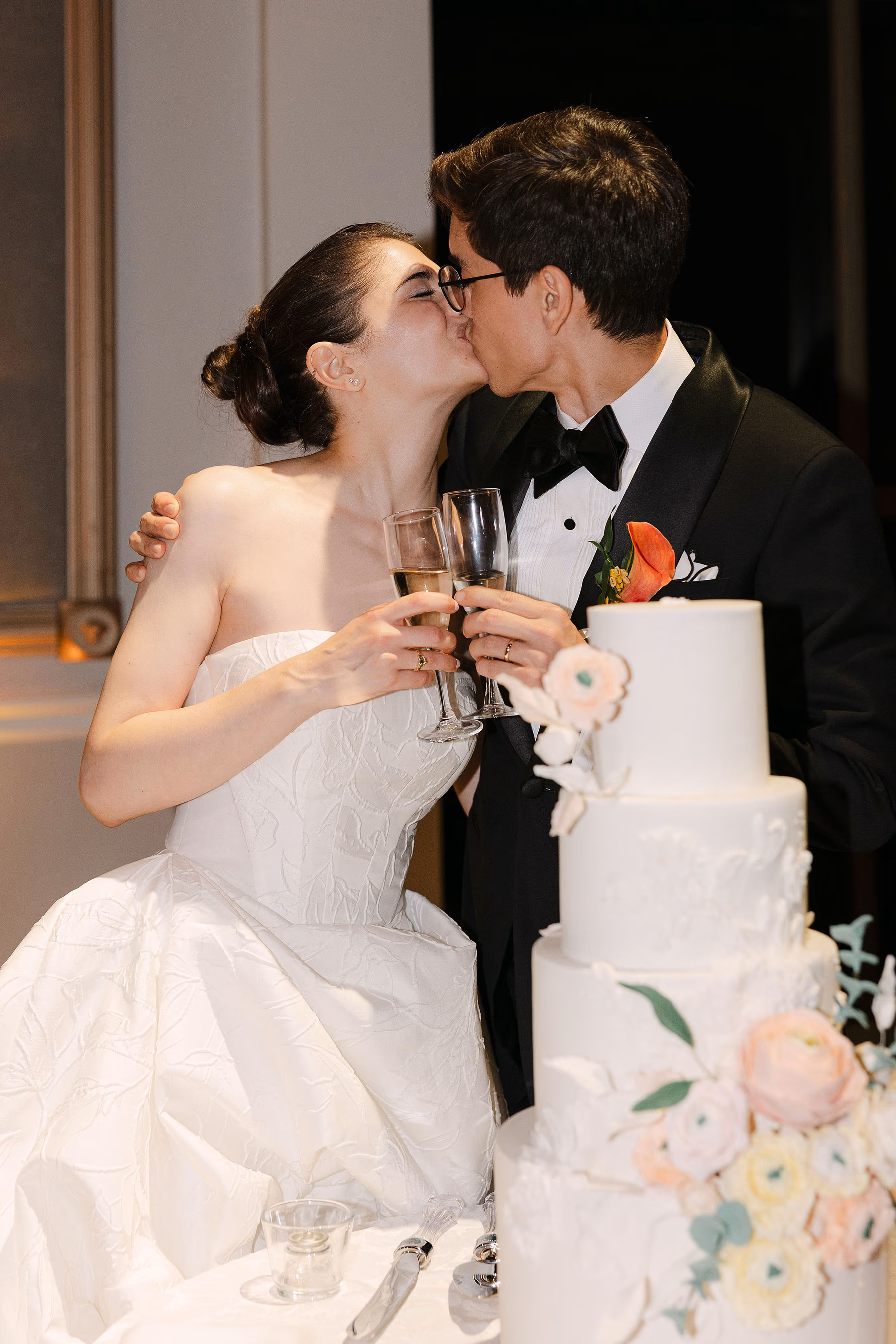 couple cut the cake at reception at Liberty Grand