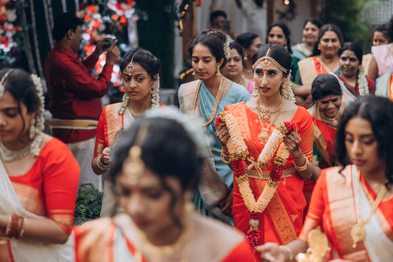 Bridal party in red sarees arriving for Tamil wedding at greenhouse venue Toronto