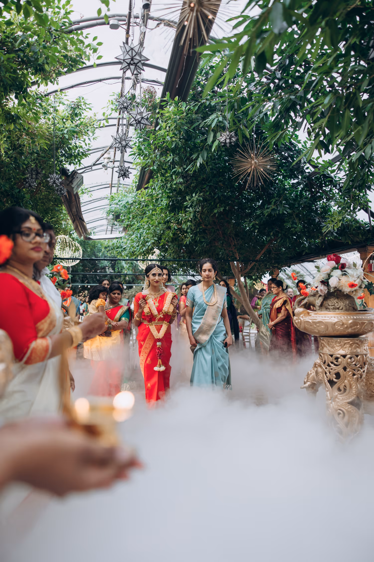 tamil bride enters the aisle in Madison Greenhouse