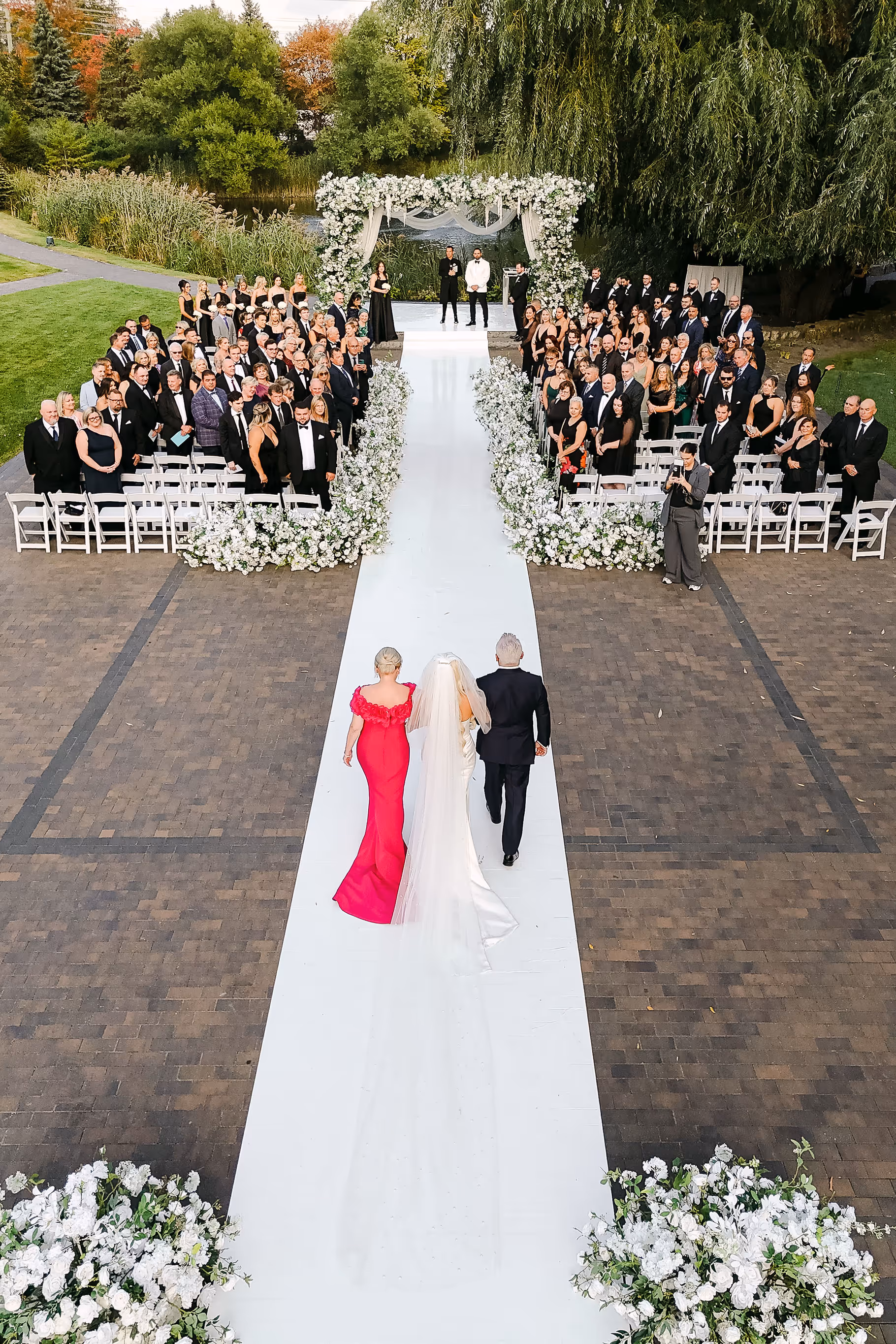 outdoor wedding ceremony aisle lined with white florals at The Arlington Estate Vaughan — Astora Studio