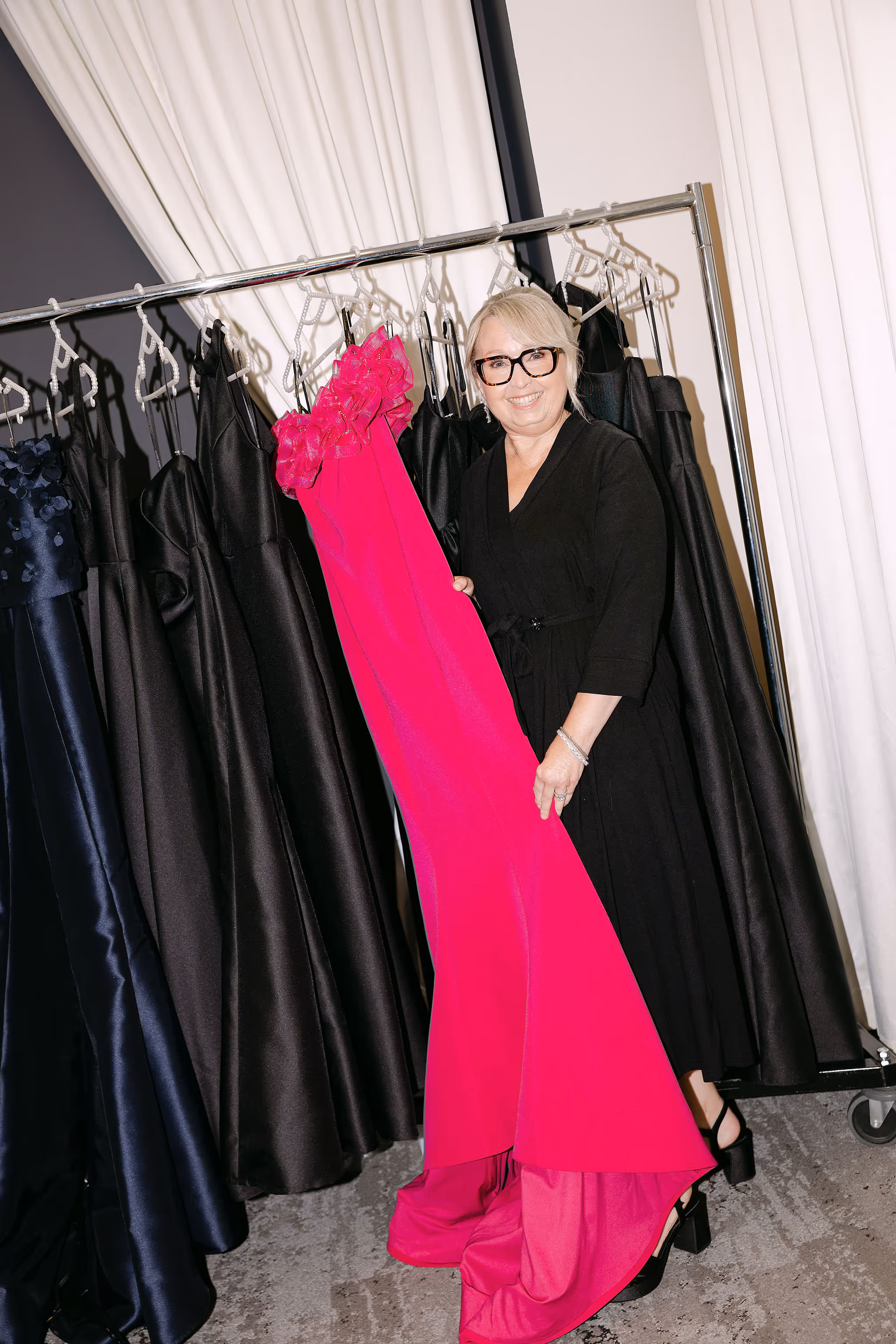 mother of the bride posing with her dress