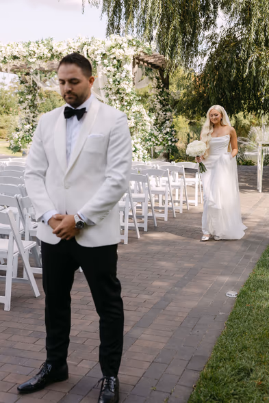 groom in white tuxedo before the ceremony at The Arlington Estate Vaughan — Astora Studio