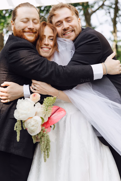 emotional group hug candid wedding photography
