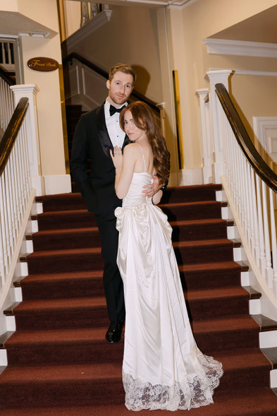 bride and groom portrait on staircase Queen’s Landing Niagara-on-the-Lake wedding reception